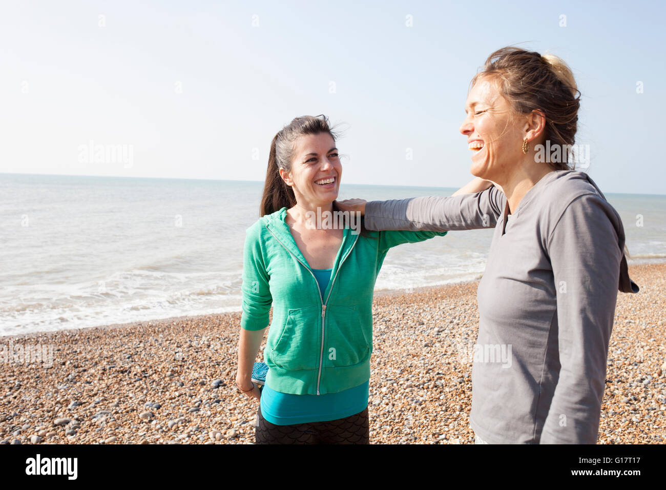 Two women training, on Brighton beach Stock Photo