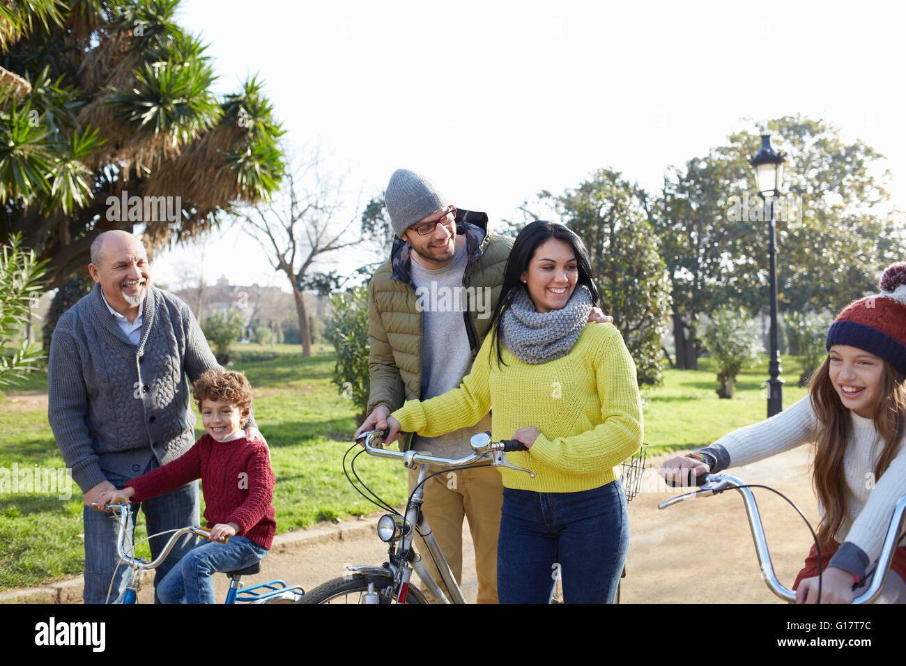 Multi generation family in park on with bicycles Stock Photo