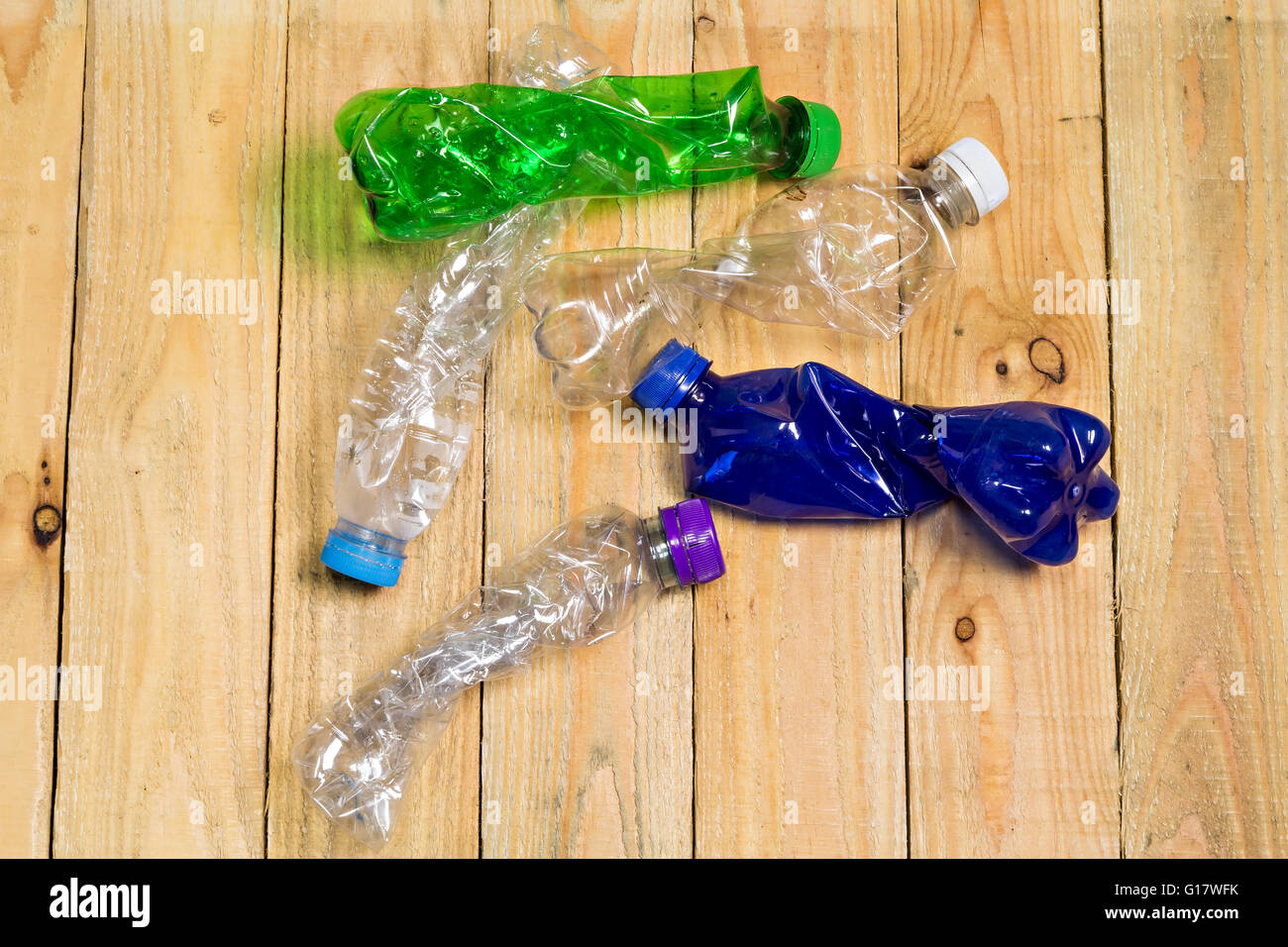 used plastic bottles on wooden board Stock Photo Alamy