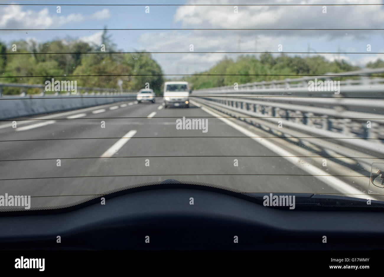 The highway traffic from the rear window Stock Photo - Alamy