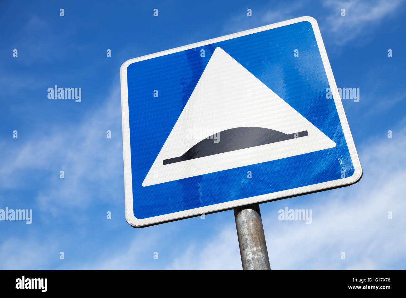 Speed Bump. Square road sign over cloudy sky background Stock Photo