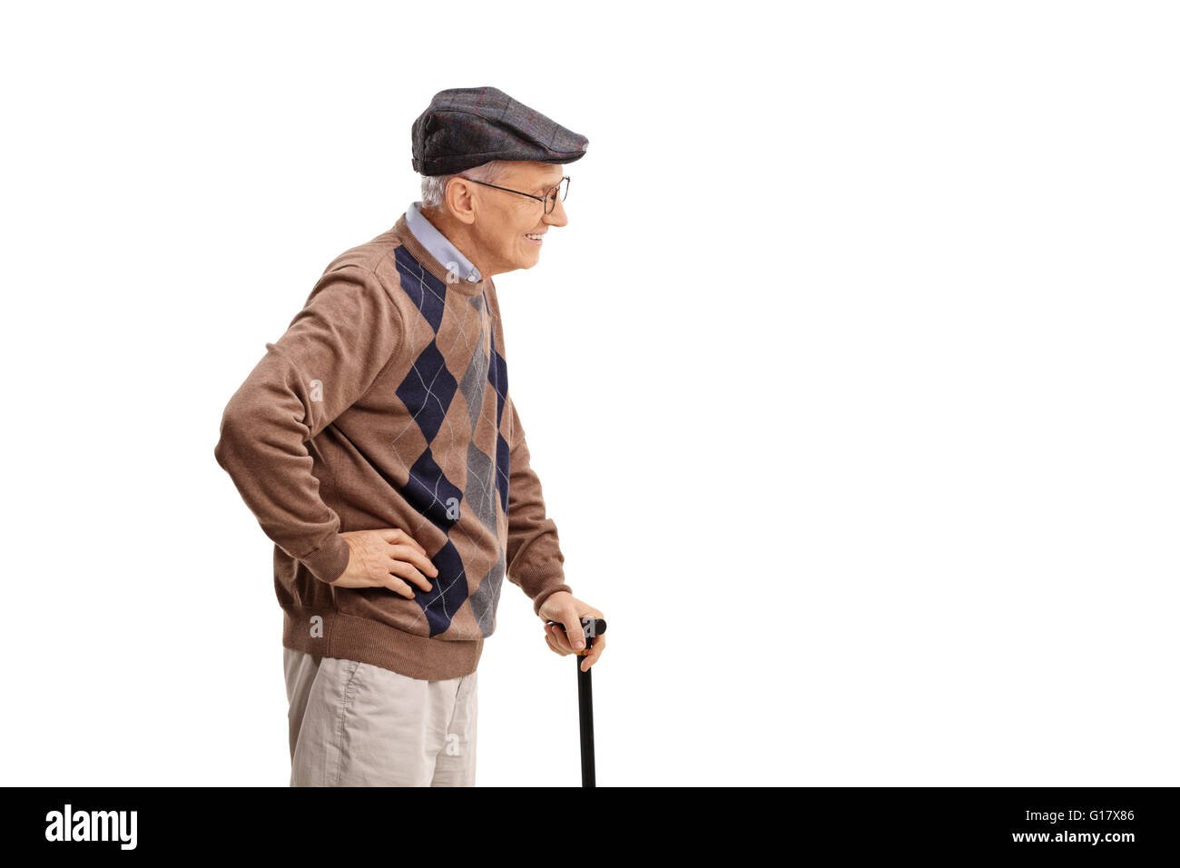 Profile shot of a senior gentleman with cane isolated on white ...