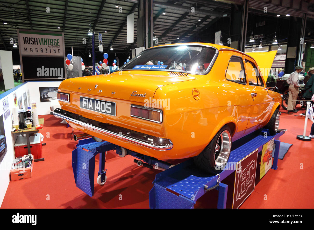 Restored Mk1 Ford Escort on display ramps at a classic car show, Dublin RDS, ireland Stock Photo