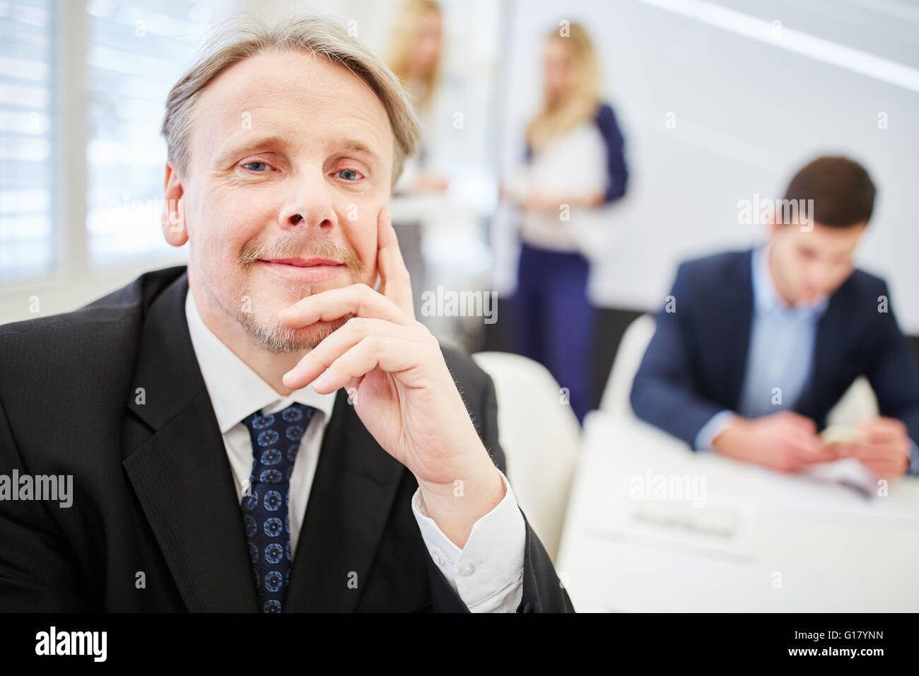 Old businessman as CEO with competence and leadership Stock Photo