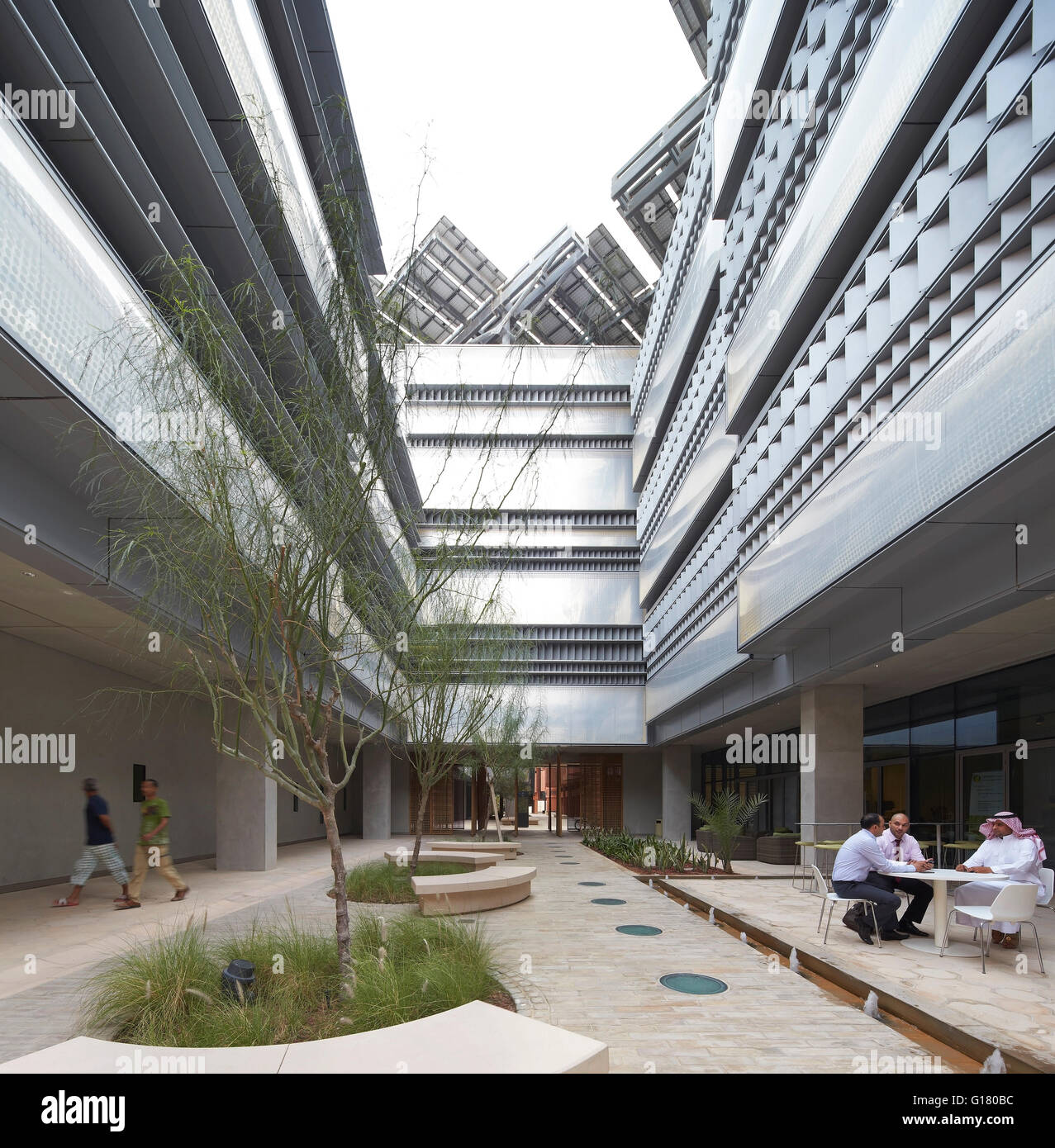 The Siemens Building, designed by Sheppard Robson with interior courtyard and seating. Masdar City, Masdar City, United Arab Emirates. Architect: various, 2014. Stock Photo
