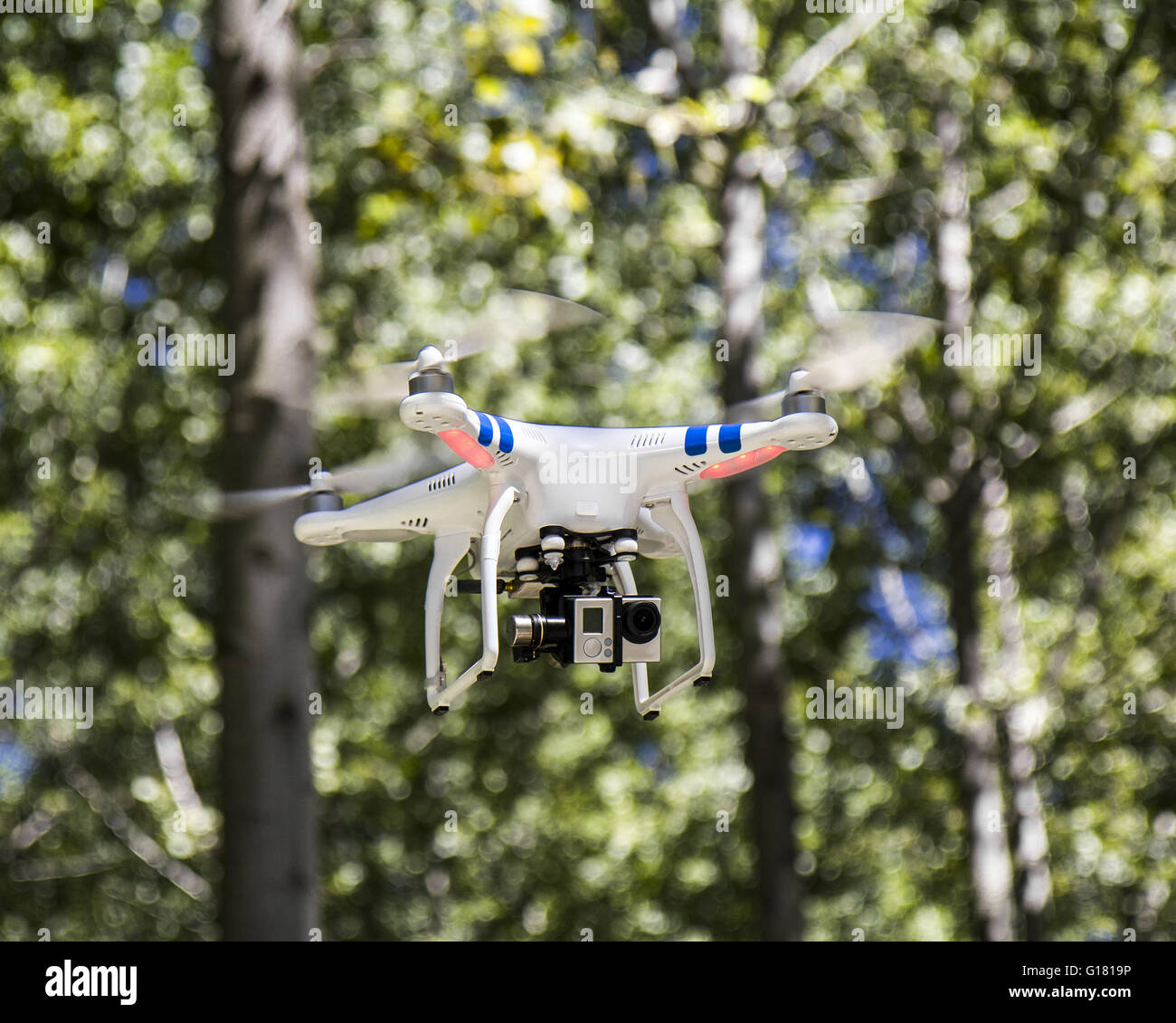 Quadcopter drone flying, technology and security concepts Stock Photo