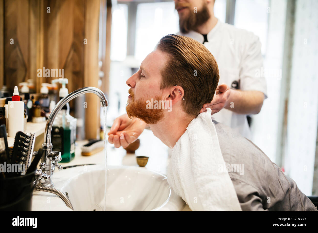 Hair beard and mustache treatment in barber shop Stock Photo - Alamy