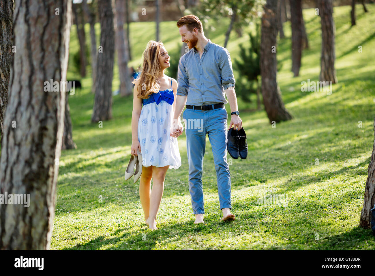 Woman walking barefoot park hi-res stock photography and images - Alamy