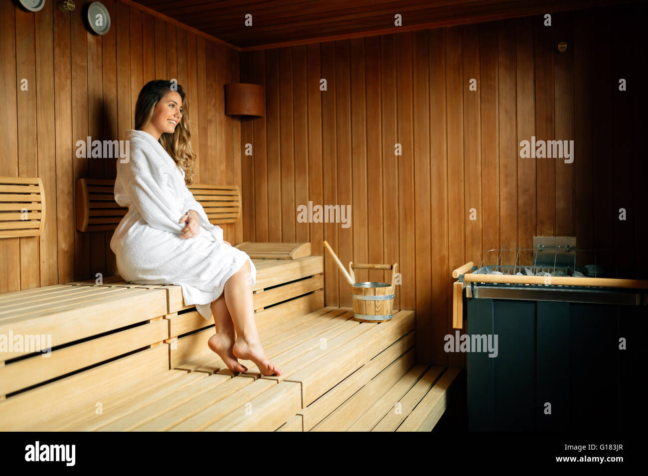 Beautiful woman resting in sauna and sweating Stock Photo Alamy