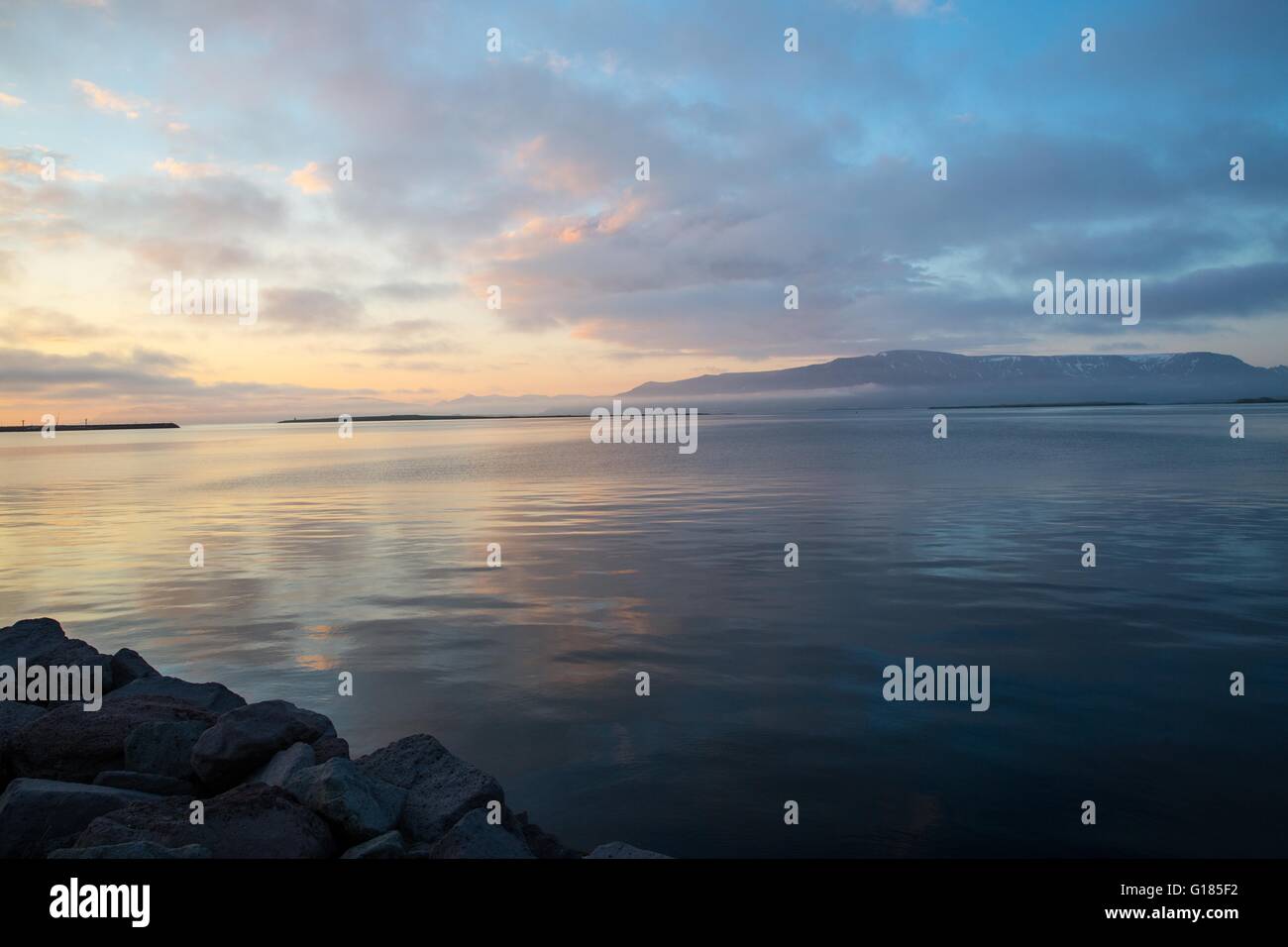 View across ocean and dramatic sky at sunset, Reykjavik, Iceland Stock Photo