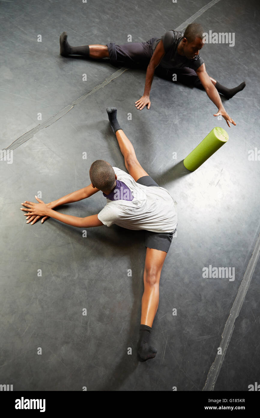 Dancers doing stretching exercise Stock Photo