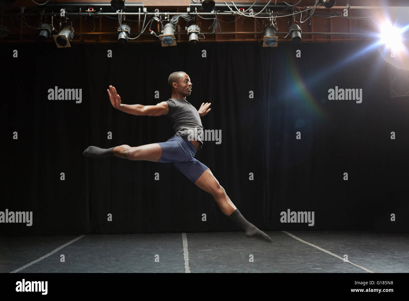 Dancer in midair pose Stock Photo