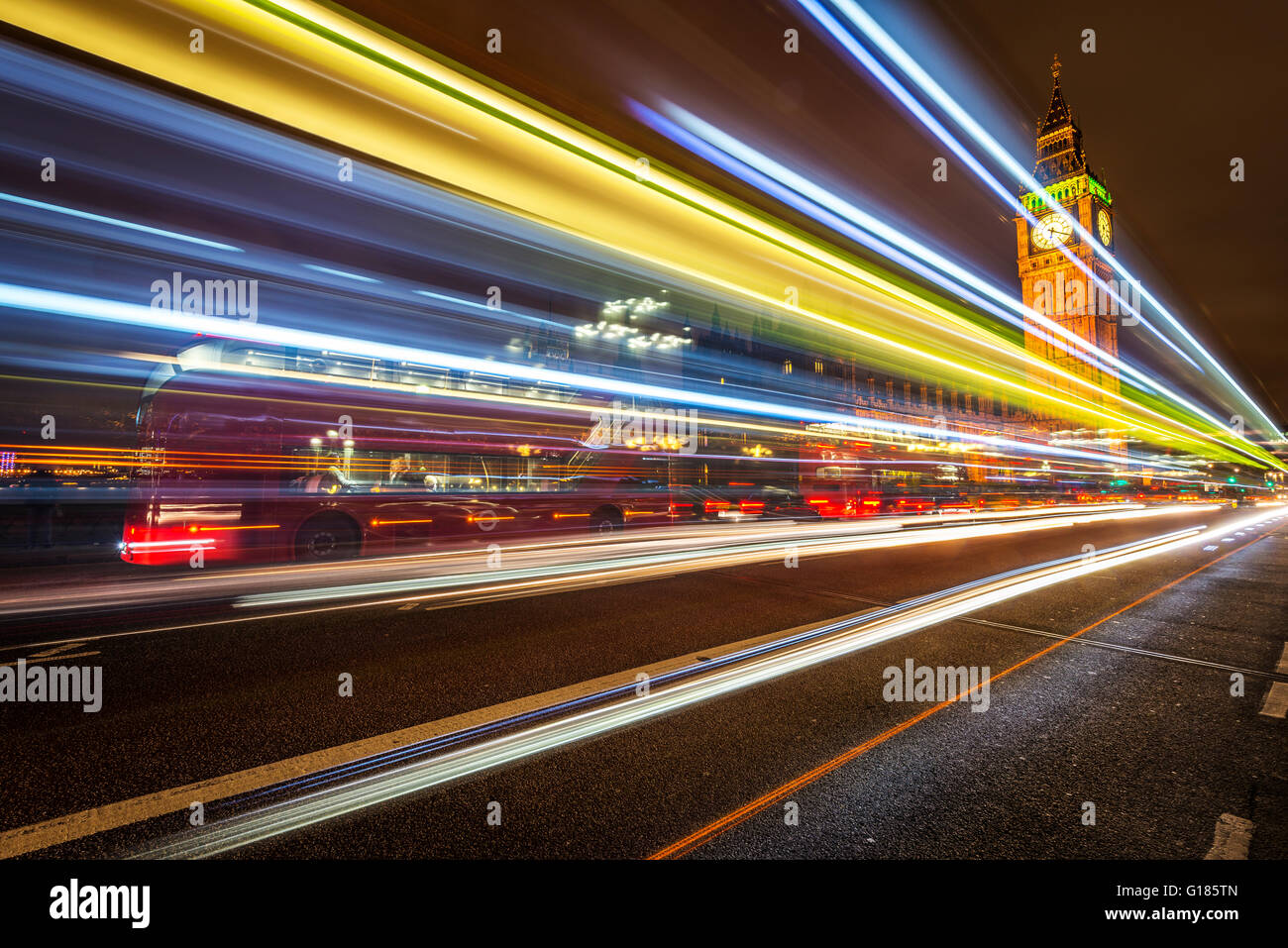 big ben houses of parliament westminster london england uk night cars streaks long exposure light trails car trails bridge westm Stock Photo