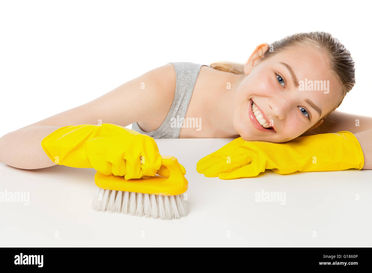Young woman with scrub brush and cleansing spray isolated Stock Photo