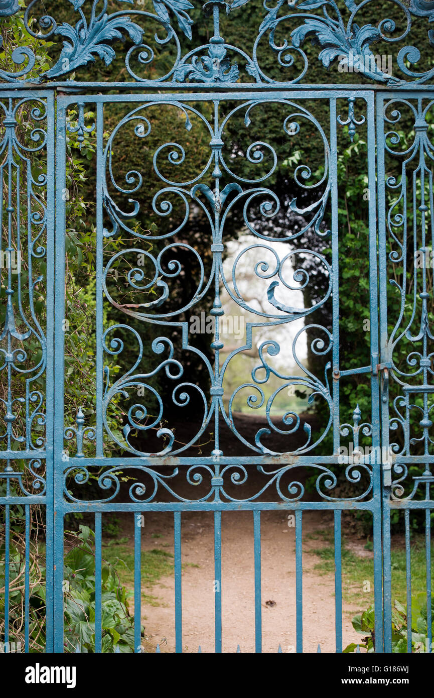 Walled garden blue wrought iron gate at Rousham House and Garden. Oxfordshire, England Stock Photo