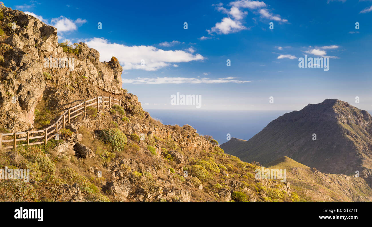 Panoramic view from walking path at top of the Barranco de Fanabe towards coast of Tenerife with Roque del Conde bottom right Stock Photo
