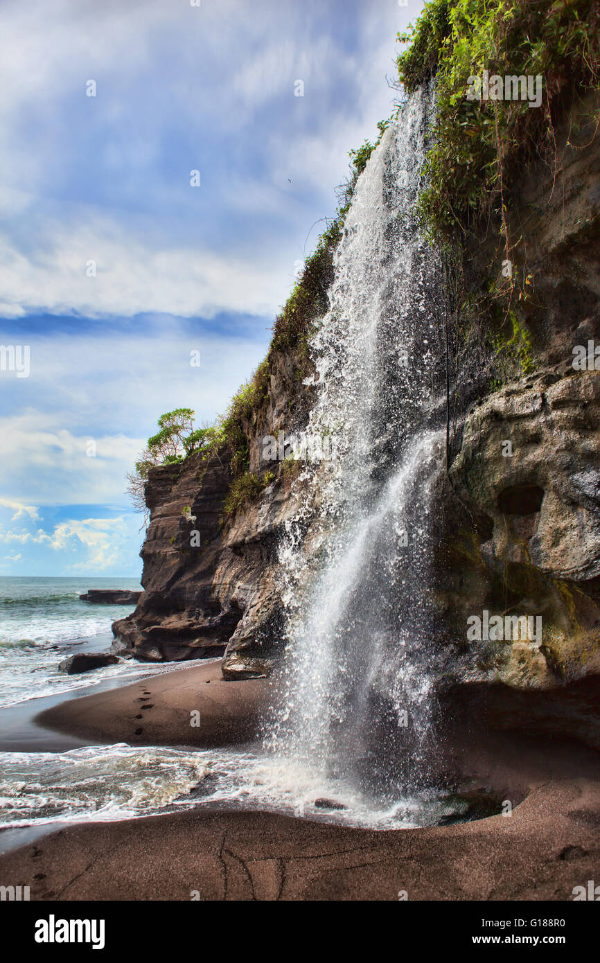 Waterfall At Melasti Beach Stock Photo