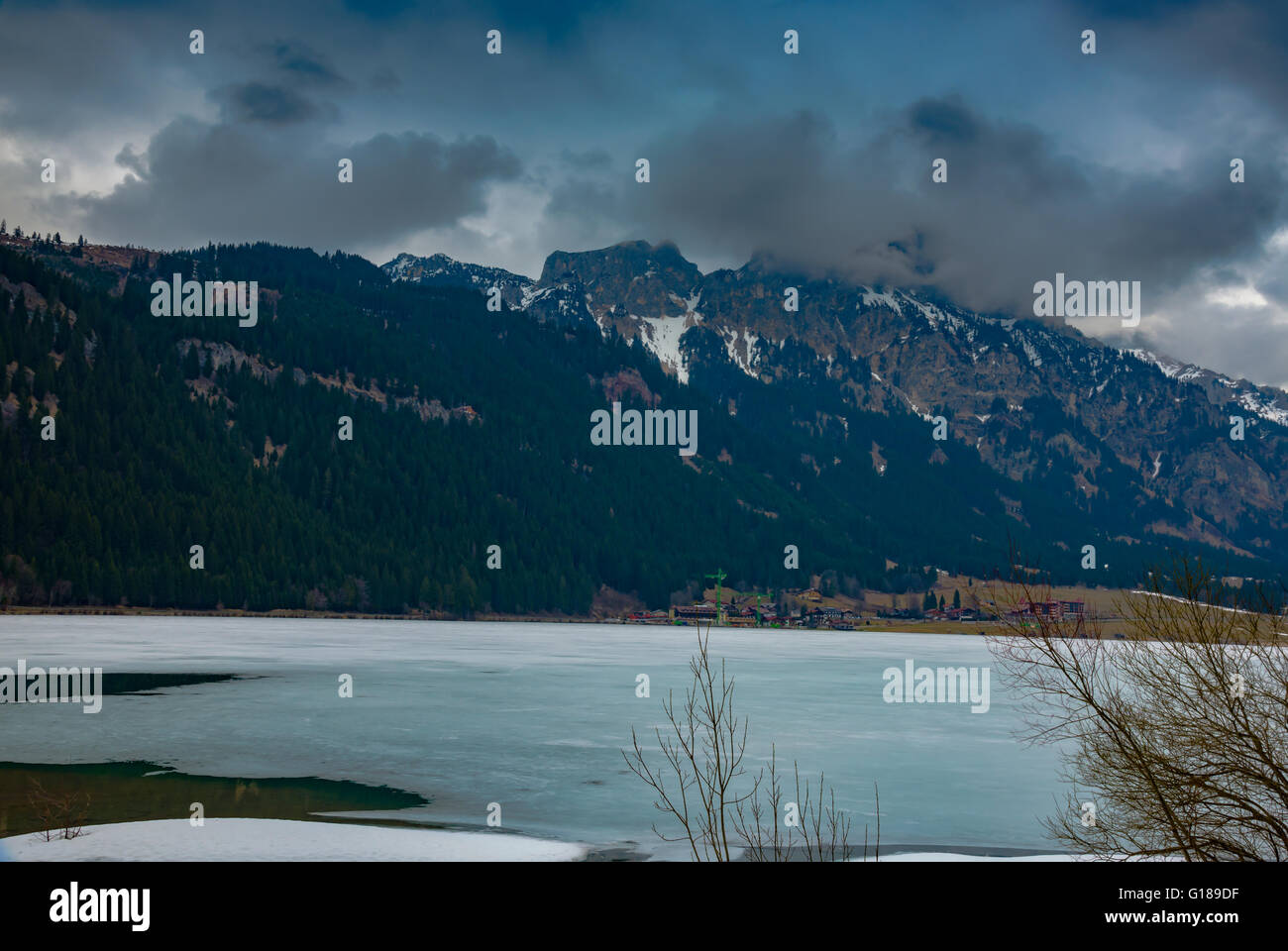 View into beautiful austrian landscape on cloudy spring day Stock Photo