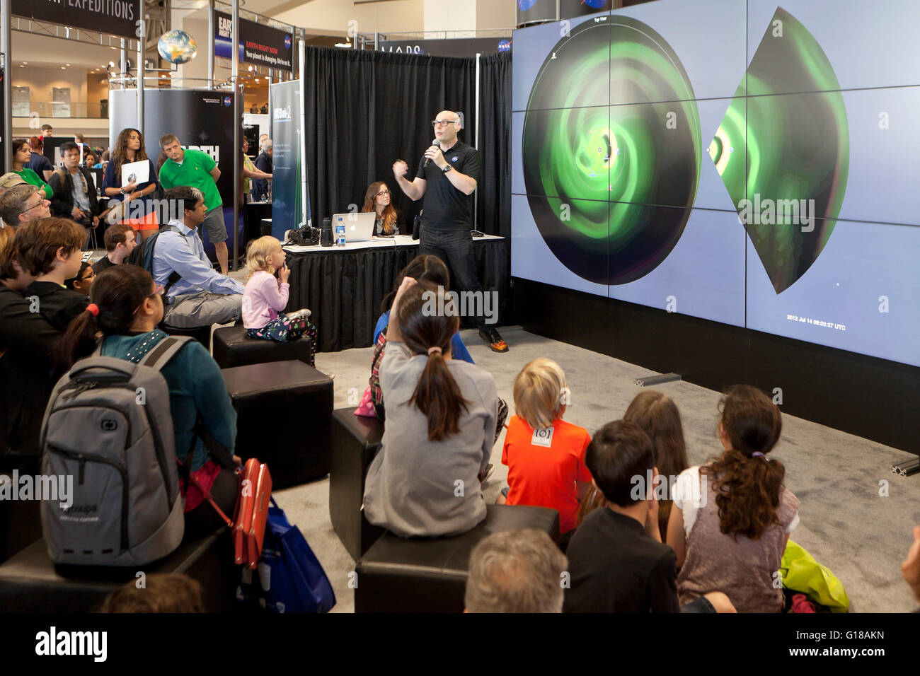 NASA scientist lecturing to children about space at science fair USA
