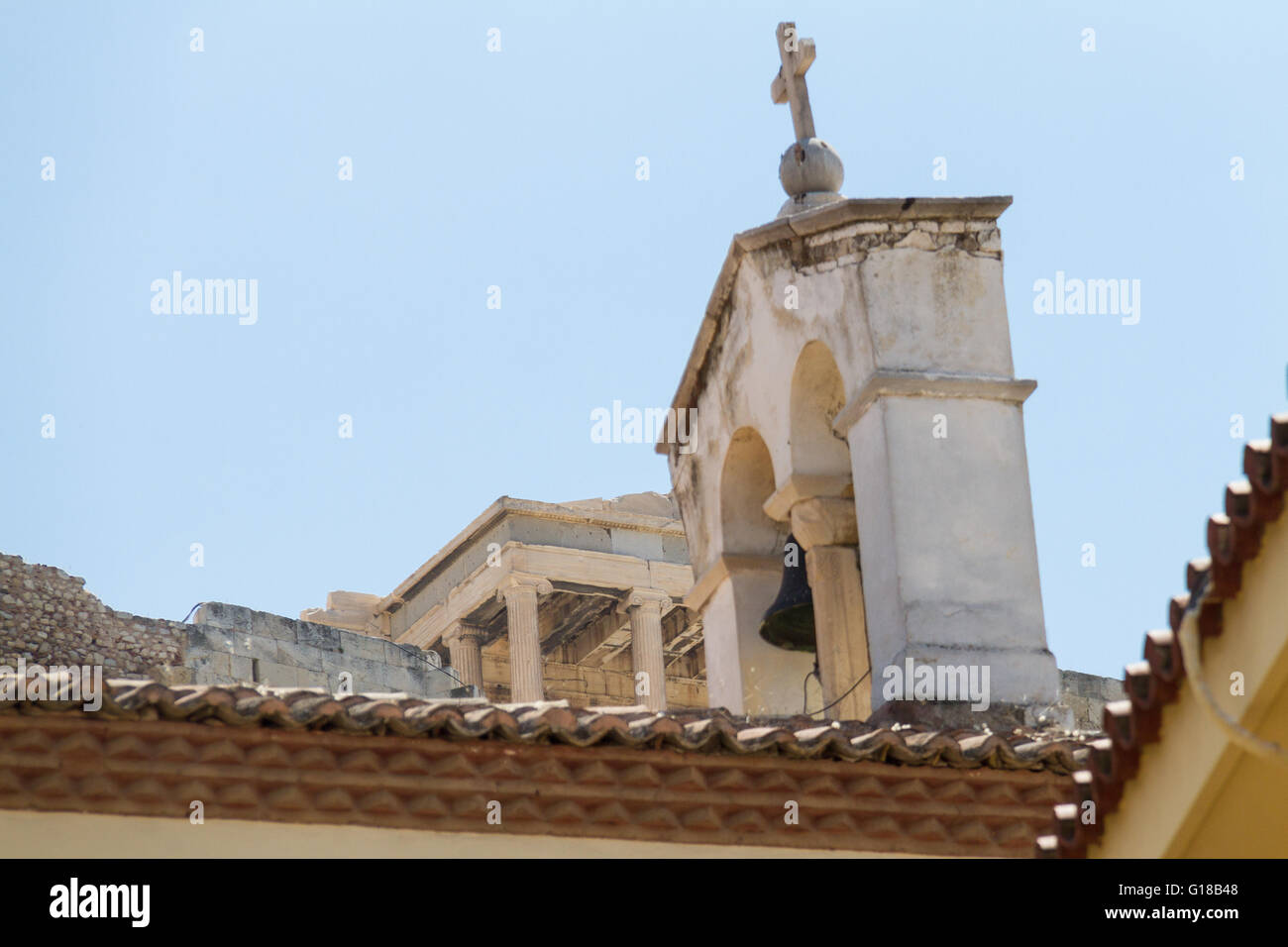 Church bell tower and Acropolis view from Plaka, Athens. Spring 2016 photo Stock Photo