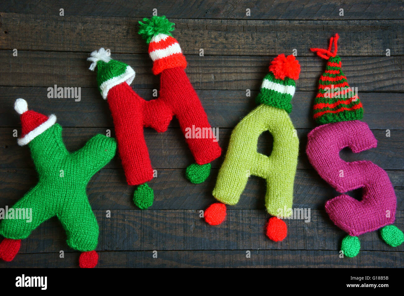 Christmas background, Xmas alphabet handmade by knitted, amazing ornament for noel as letter, gift, hat knit,  hand made product for winter holiday Stock Photo