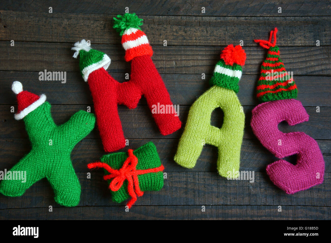 Christmas background, Xmas alphabet handmade by knitted, amazing ornament,  hat knit, hand made product for winter holiday Stock Photo