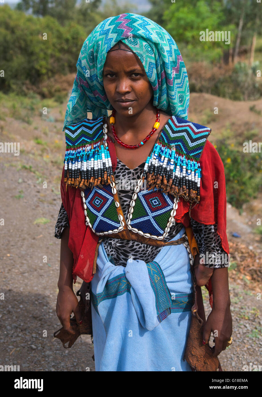 Raya tribe woman with a beaded baby carrier, Semien wollo zone, Woldia ...