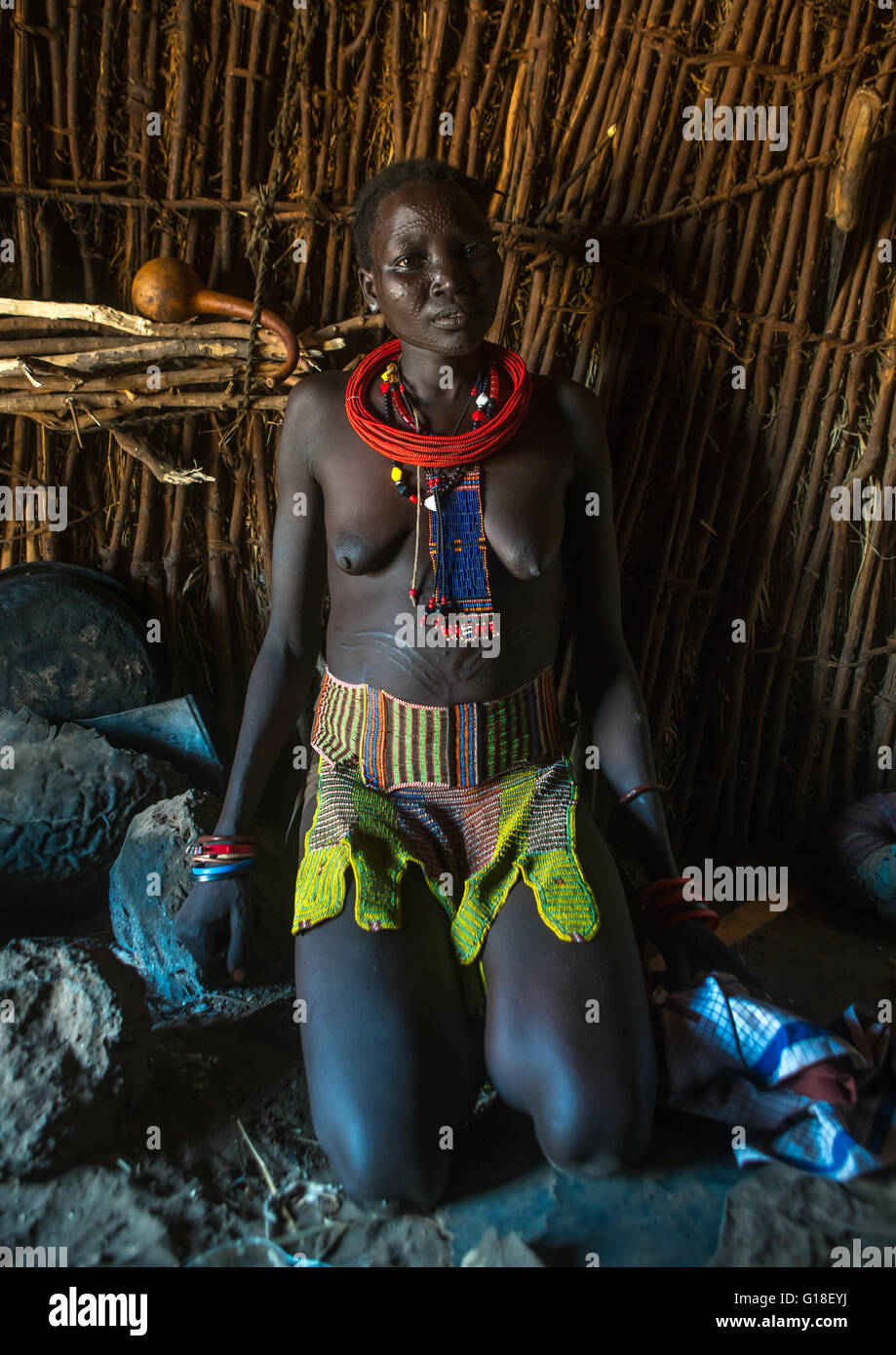 Toposa tribe woman with a beaded belt, Omo valley, Kangate, Ethiopia Stock Photo