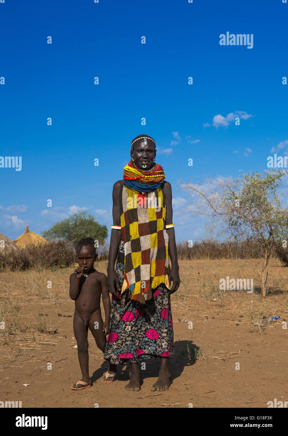 Murle tribe woman with a beaded apron and her child, Omo valley, Kangate, Ethiopia Stock Photo