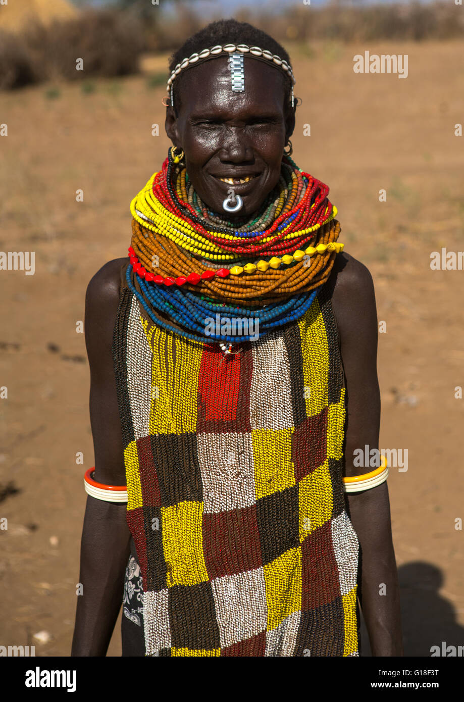 Murle tribe woman with a beaded apron and necklaces, Omo valley, Kangate, Ethiopia Stock Photo