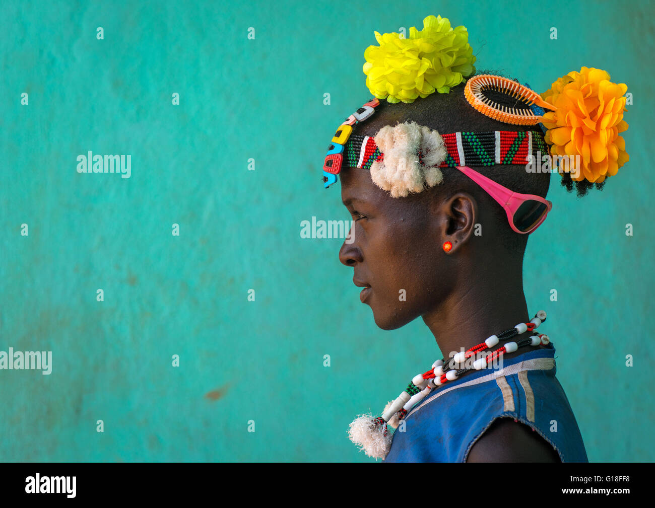 Profile of a bana tribe man with plastic flowers in the hair, Omo valley, Key afer, Ethiopia Stock Photo