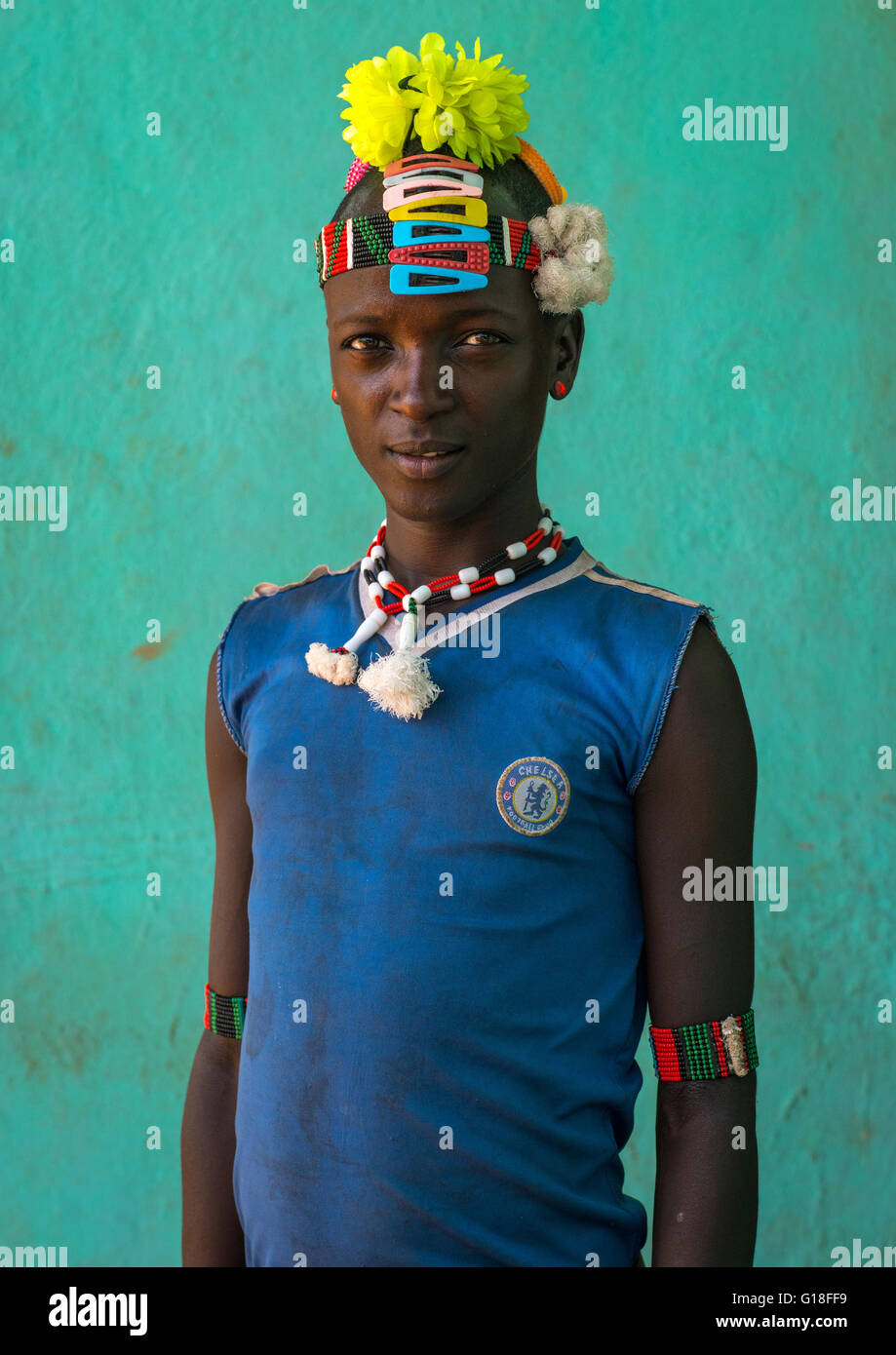 Portrait Of A Bana Tribe Man With Plastic Flowers In The Hair And