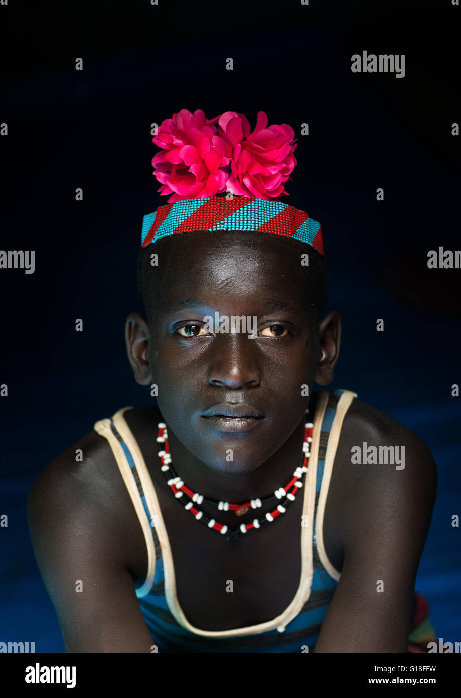 Portrait of a bana tribe man with red plastic flower in the hair, Omo valley, Key afer, Ethiopia Stock Photo
