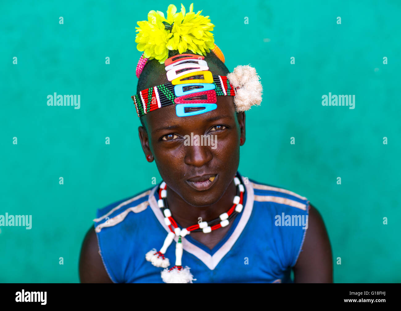 Portrait of a bana tribe man with yellow plastic flower in the hair, Omo valley, Key afer, Ethiopia Stock Photo