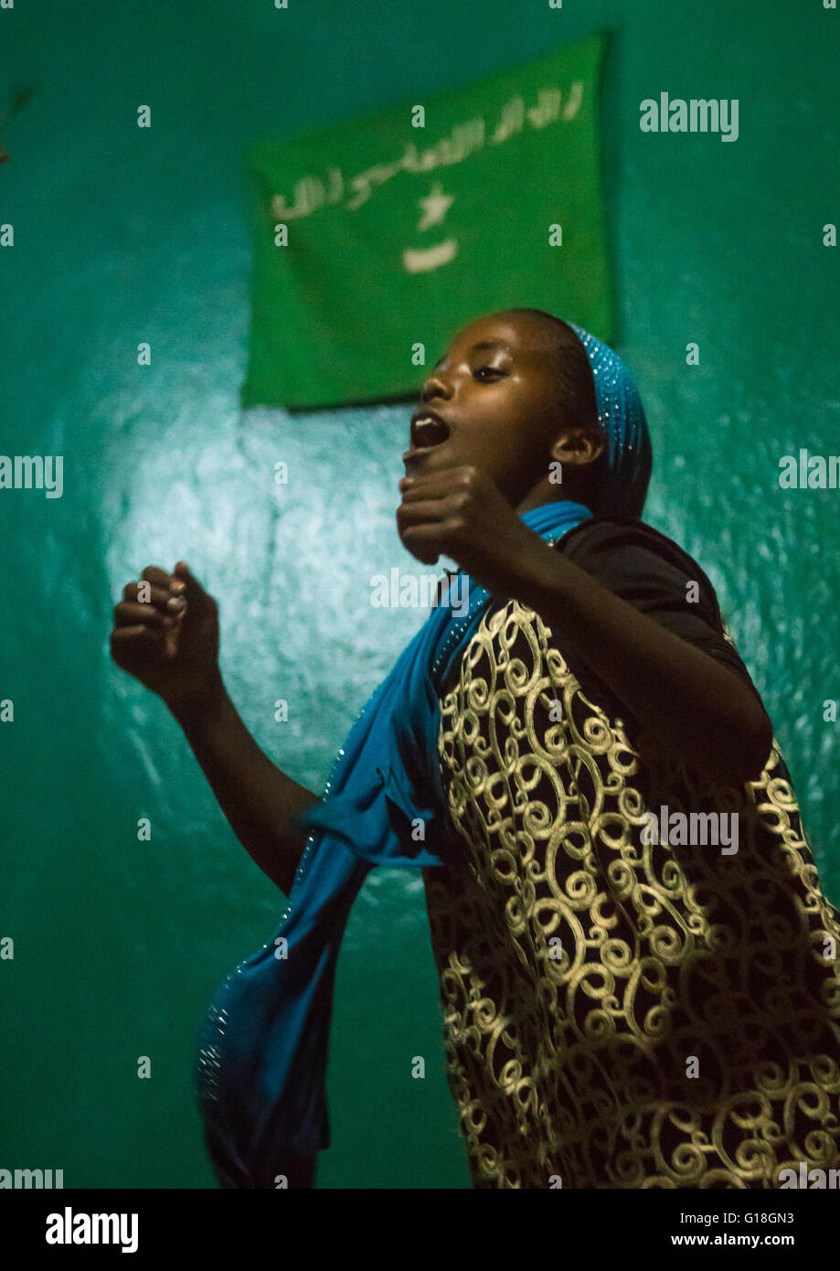 Sufi teenage girl goes into a trance during a ceremony, Harari region, Harar, Ethiopia Stock Photo