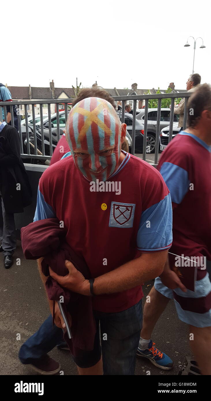 London, England. 10th May 2016.  A West Ham United fan displays his head painted in the clubs claret and blue colours. Part of the celebration of the last game at the Boleyn Ground.  Milton Cogheil/Alamy Live News Stock Photo