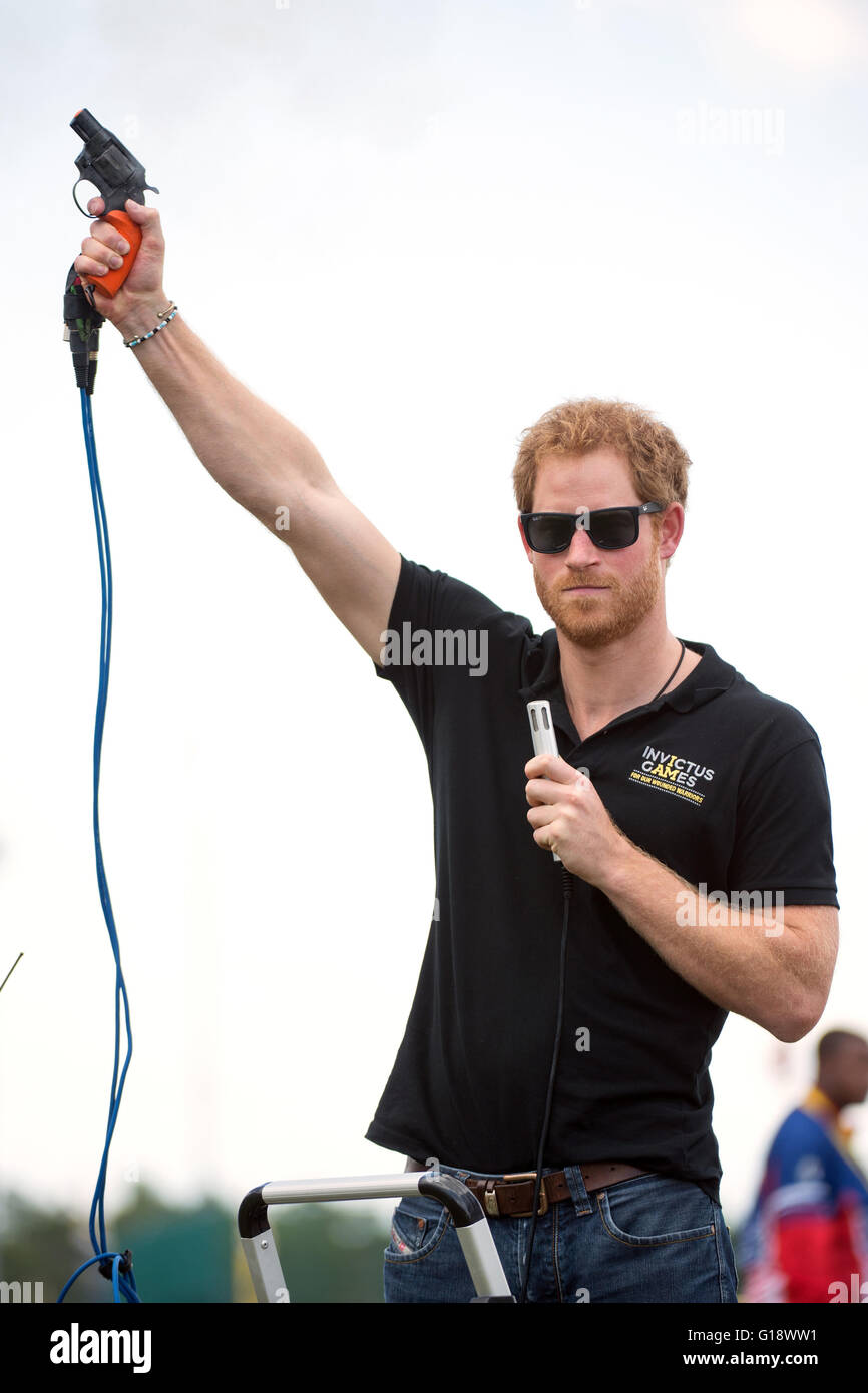HRH Prince Harry of Wales fires the starter gun during the 2016 Invictus Games May 10, 2016 in Orlando, Florida. The Invictus Games are an international Paralympic-style multi-sport event, created by Prince Harry. Stock Photo