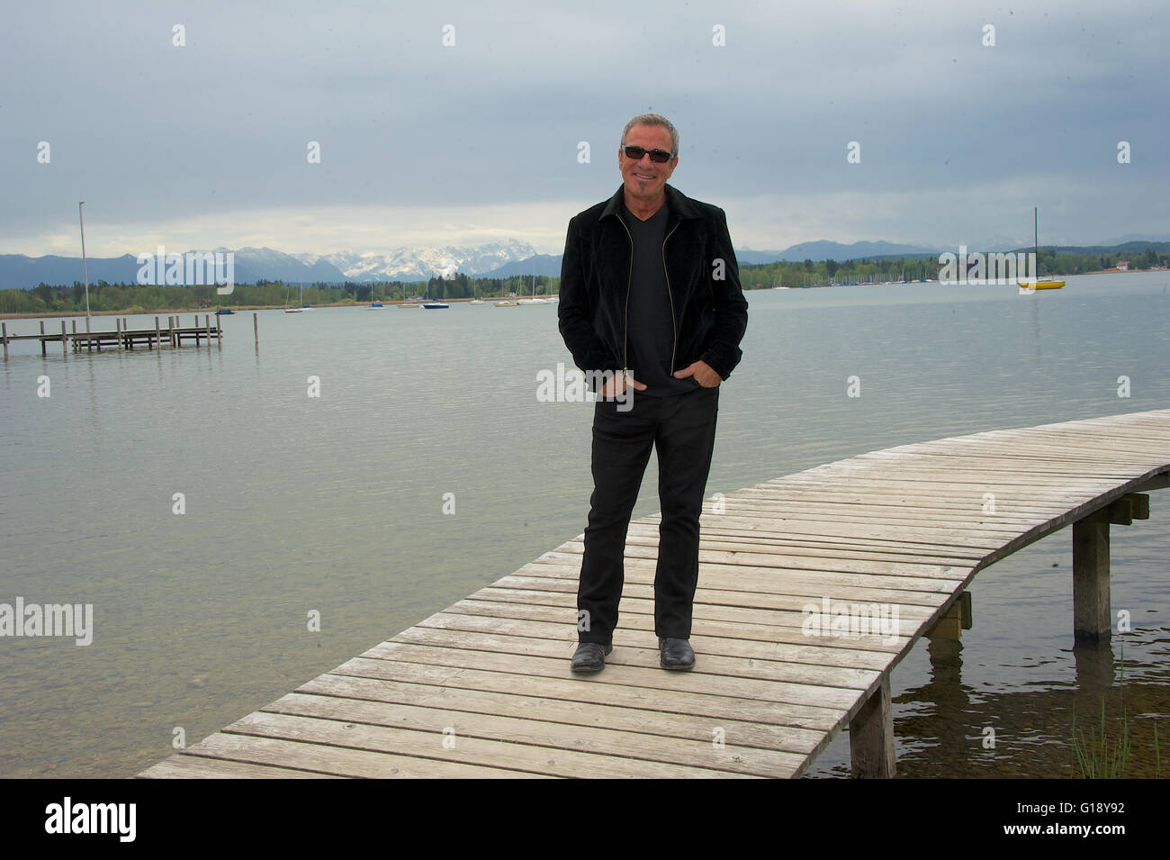 Seeshaupt, Germany. 10th May, 2016. dpa EXCLUSIVE - Tico Torres, drummer of Bon Jovi, stands on a jetty after a presentation of his 'Rock Star Baby' fashion collection at the Lupaco Concept Store in Seeshaupt, Germany, 10 May 2016. Photo: Ursula Dueren/dpa/Alamy Live News Stock Photo