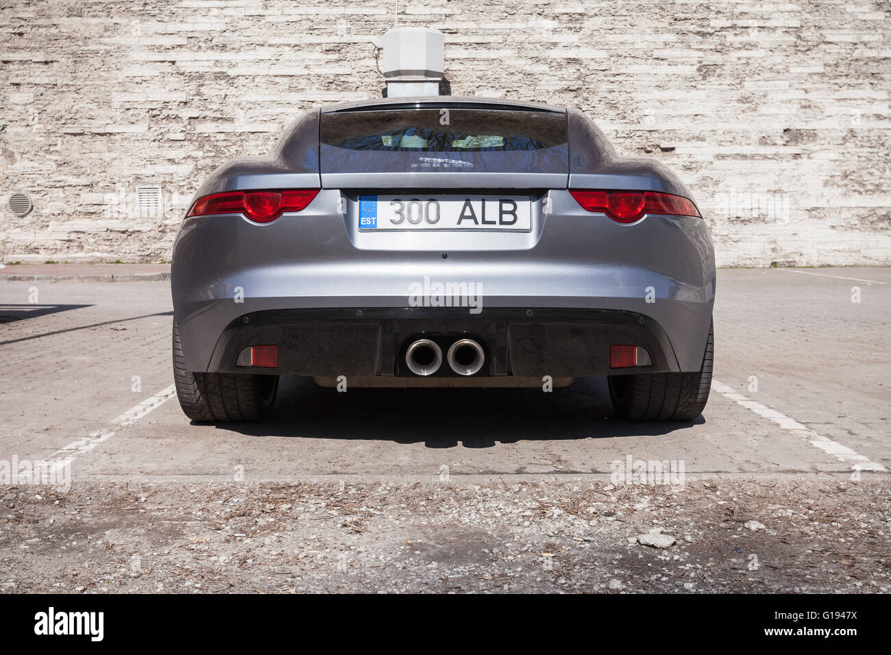 Tallinn, Estonia - May 2, 2016: Gray Jaguar F-Type coupe, rear view. Two-seat sports car, based on a platform of the XK converti Stock Photo