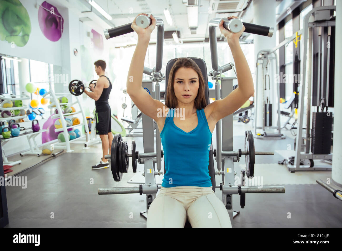 Beautiful woman training in gym and keeping body in shape Stock Photo