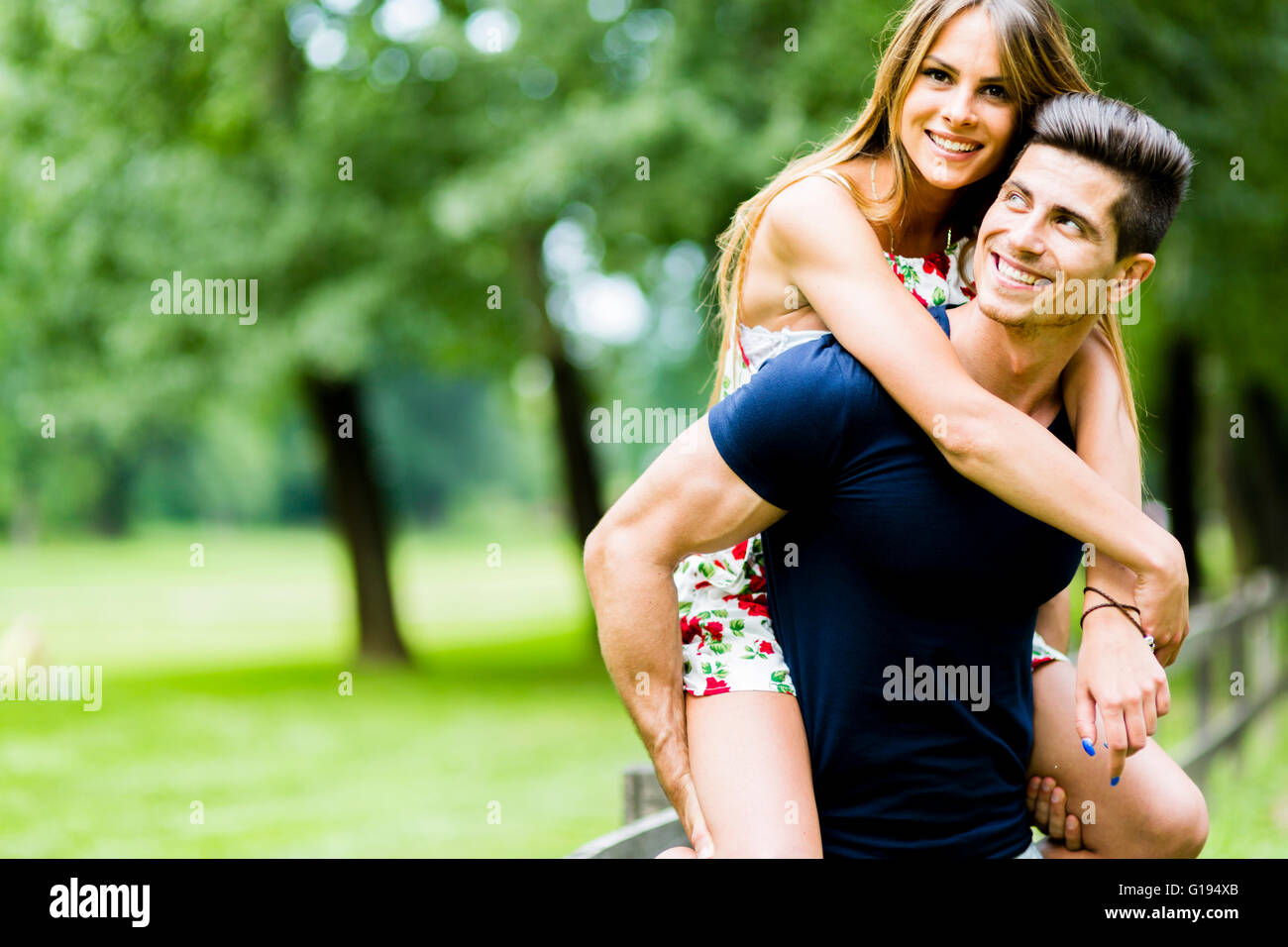 Happy couple in love having fun outdoors and smiling Stock Photo