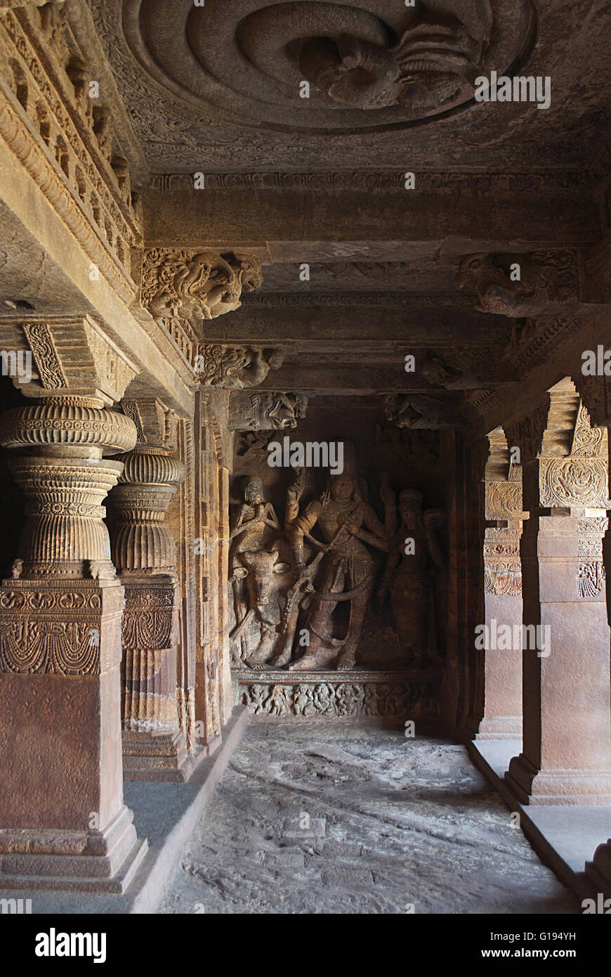 Cave 1: A sculpture depicting Nandi, the bull, Bhringi, a devotee of Shiva; a female decorated goddess, all of which are part of Stock Photo