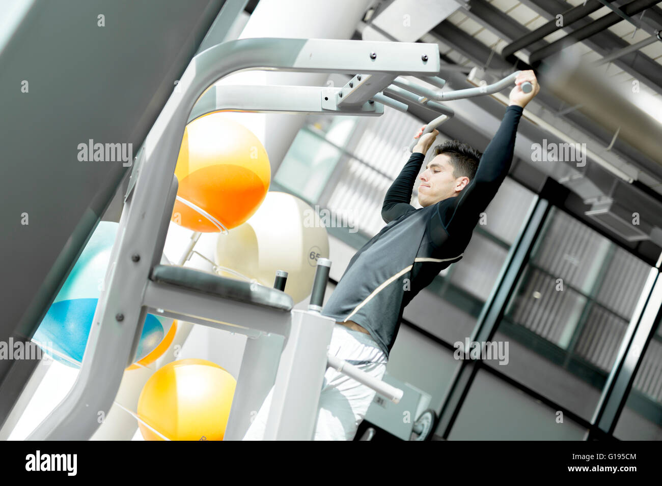 Young handsome man working out in a  gym and living a healthy lifestyle Stock Photo