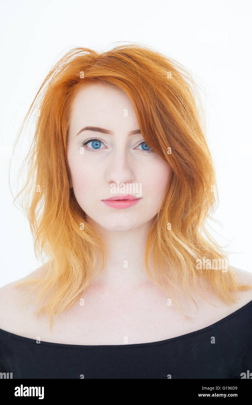 Portrait of a young woman with pale skin and red hair. Stock Photo