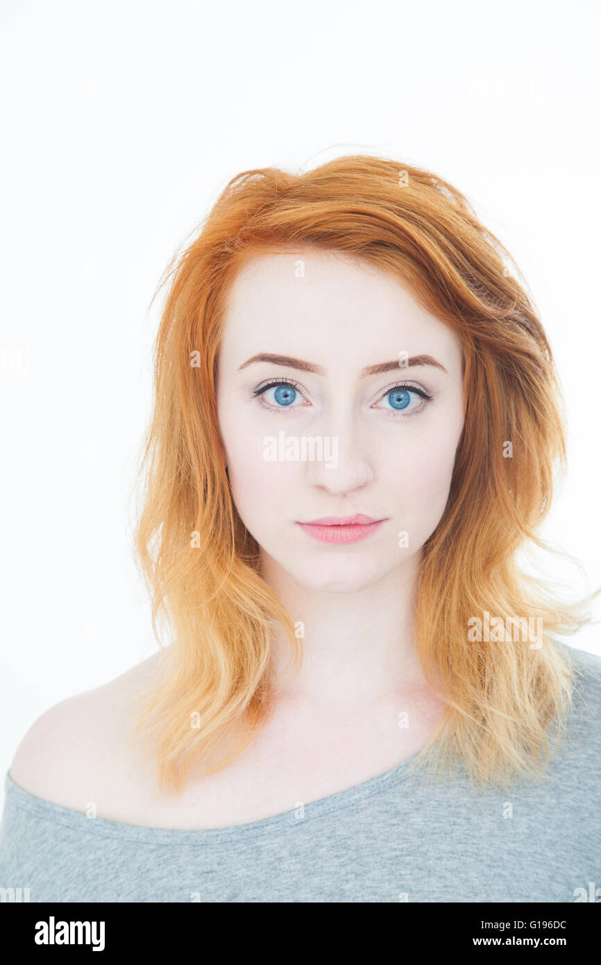 Portrait of a young woman with pale skin and red hair. Stock Photo