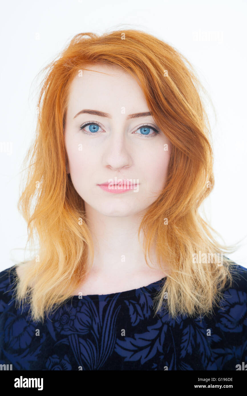 Portrait of a young woman with pale skin and red hair. Stock Photo