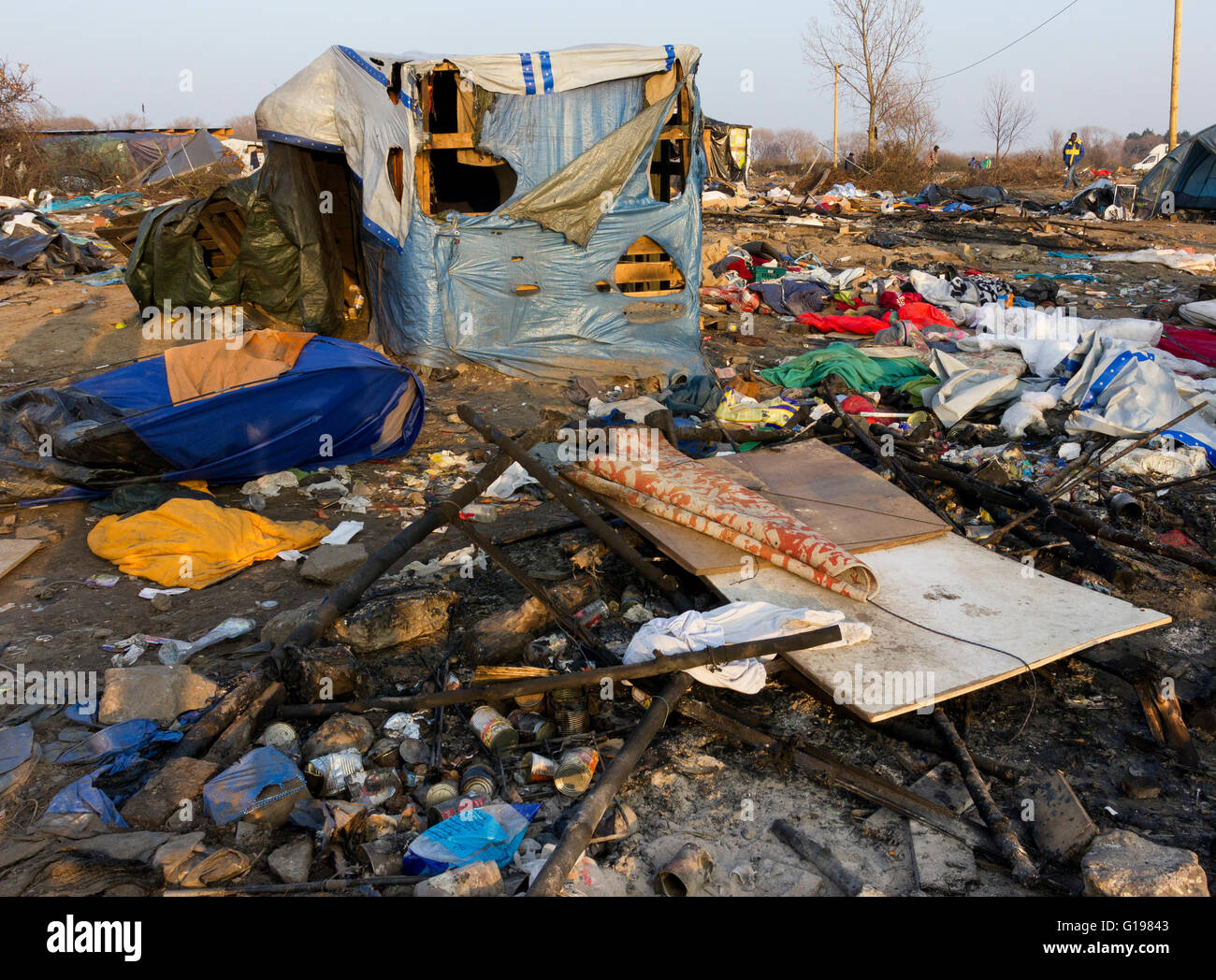 Burnt out shelters. The Jungle, refugee & migrant camp, Calais, Northern France Stock Photo
