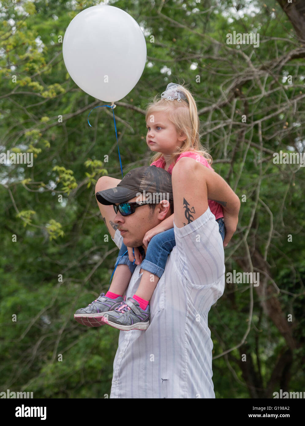 Pioneer Days annual celebration in High Springs Florida. Dad gives a ride to his daughter. Stock Photo
