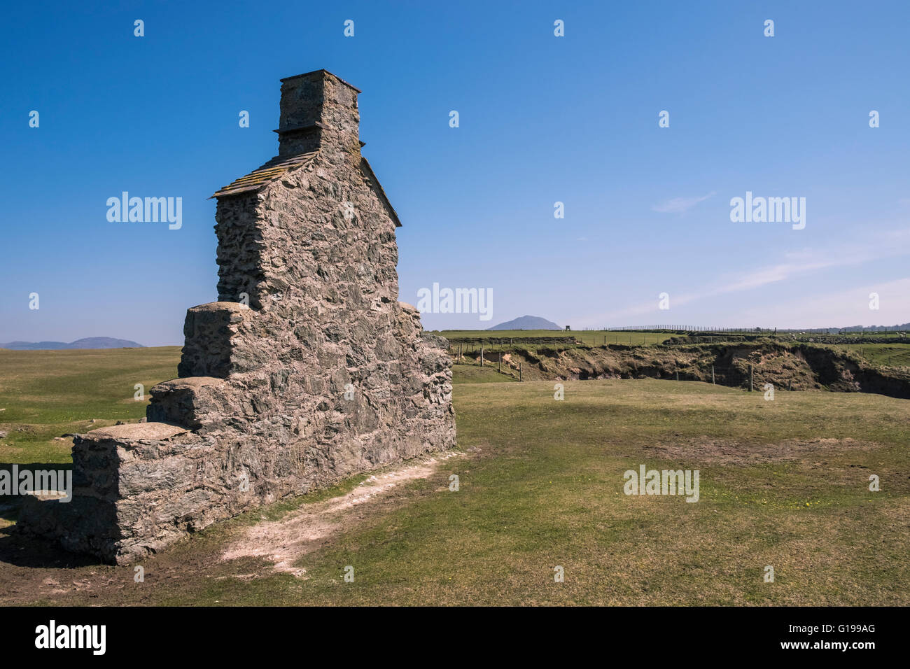 Remains of ruined cottage on remote north wales coast, Gwynedd, Wales, UK Stock Photo