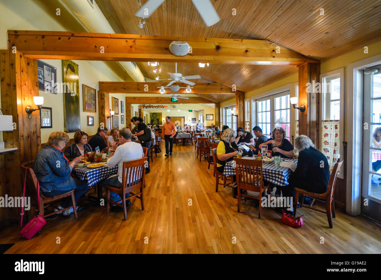 A satisfied crowd of people in wood designed dining room, famous for Country Cooking, at the Loveless Cafe & Motel, Nashville TN, USA Stock Photo